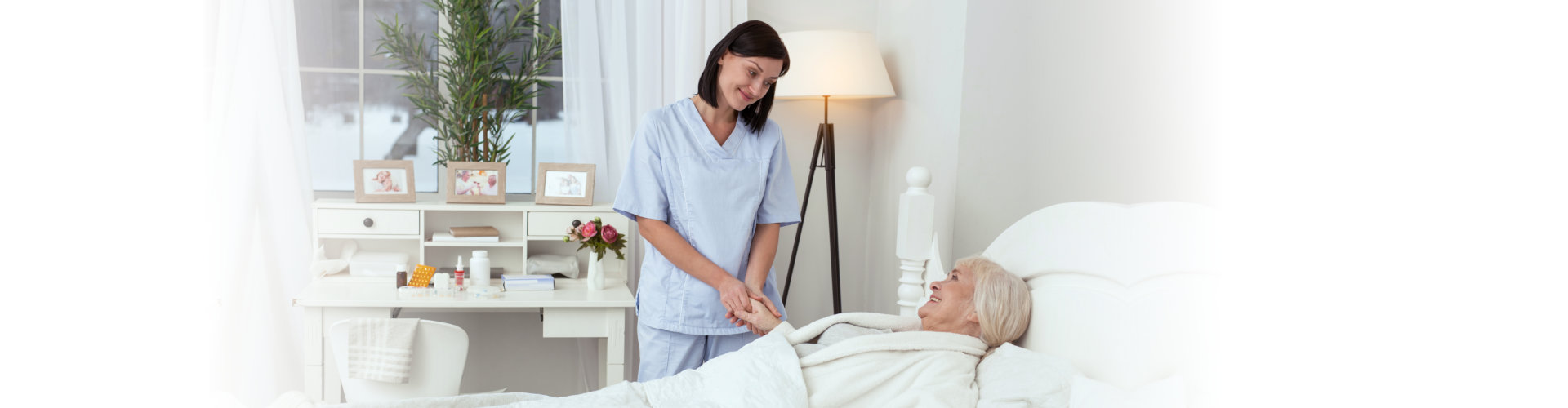 caregiver helping senior woman to rest